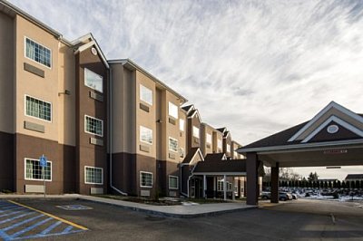 Microtel Inn & Suites by Wyndham - Washington | Hotels & Travel | Logo